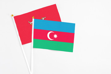 Azerbaijan and Isle Of Man stick flags on white background. High quality fabric, miniature national...