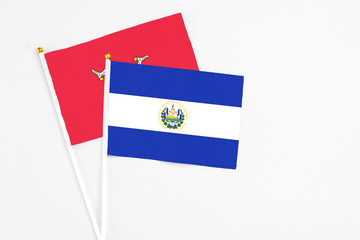 El Salvador and Isle Of Man stick flags on white background. High quality fabric, miniature...