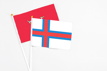 Faroe Islands and Isle Of Man stick flags on white background. High quality fabric, miniature...