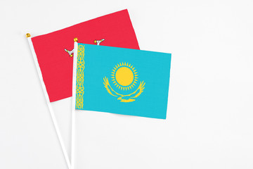 Kazakhstan and Isle Of Man stick flags on white background. High quality fabric, miniature national...