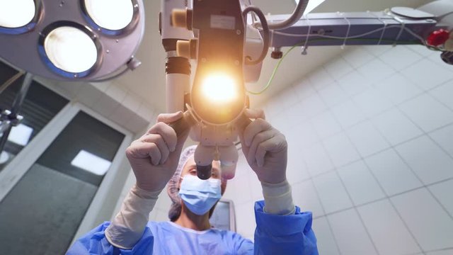 Laser vision correction. Surgeon performing laser eye vision correction