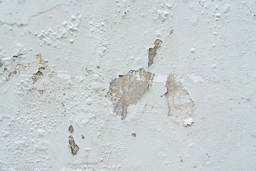 Old gray peeling paint wall
