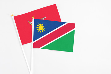 Namibia and Isle Of Man stick flags on white background. High quality fabric, miniature national...