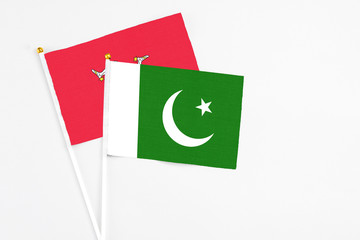 Pakistan and Isle Of Man stick flags on white background. High quality fabric, miniature national...