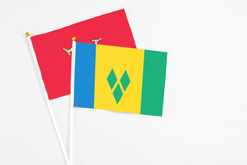 Saint Vincent And The Grenadines and Isle Of Man stick flags on white background. High quality...