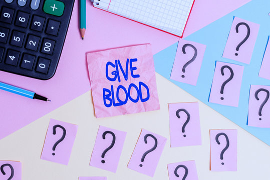 Handwriting text Give Blood. Conceptual photo demonstrating voluntarily has blood drawn and used for transfusions Mathematics stuff and writing equipment above pastel colours background