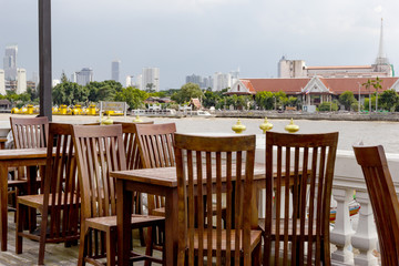 outdoor dining table set with Chao Phraya River side