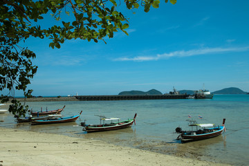 Naklejka na ściany i meble Local long tail boat is in the south of Thailand. Use for fishing and tour on the beach.