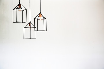 Modern lamp, bulb decorative on white wall background in home.