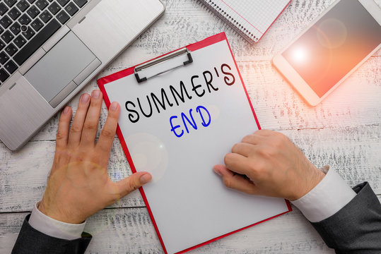 Word writing text Summer S End. Business photo showcasing End of break good memories from trips and relaxing time Hand hold writing equipment tool near modern high technology laptop device