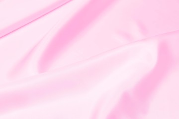 Plastic pink satin fabric texture soft blur background