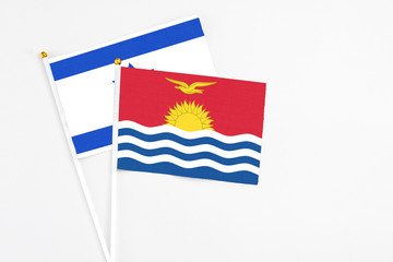 Kiribati and Israel stick flags on white background. High quality fabric, miniature national flag. Peaceful global concept.White floor for copy space.