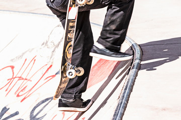 Sakater Legs with board on your hand ascending through a concrete bowl spot