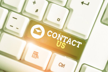 Conceptual hand writing showing Contact Us. Concept meaning Term used to describe reaching out with...