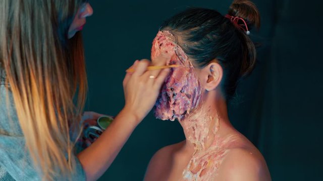 Human flesh blood gore horror prosthetic realistic makeup, closeup shot