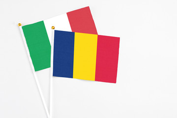 Chad and Italy stick flags on white background. High quality fabric, miniature national flag....