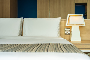 Pillow and blanket on bed with light lamp decoration interior