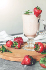 strawberry smoothie with mint on the table, front view