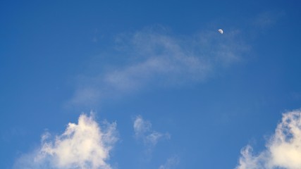 White cloud and blue sky background with copy space