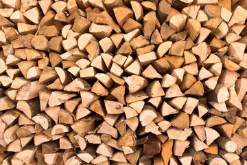 The background texture of a large pile of wood. Close up. Selective focus.
