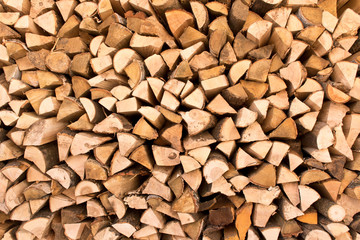 The background texture of a large pile of wood. Close up. Selective focus.