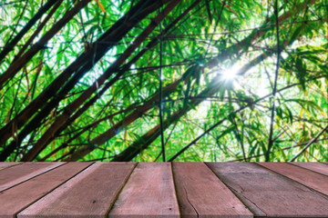 Wooden table with bamboo forest blurred background