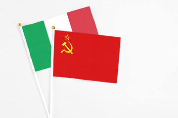 Soviet Union and Italy stick flags on white background. High quality fabric, miniature national flag. Peaceful global concept.White floor for copy space.