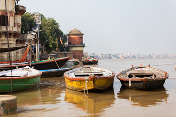 Fototapeta premium India, Varanasi, Manikarnika Ghat -boats on Ganges river