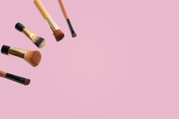 Set of make up brushes for face and eyes. Essential tools for applying make up product on face. Make up banner with copy and design space.