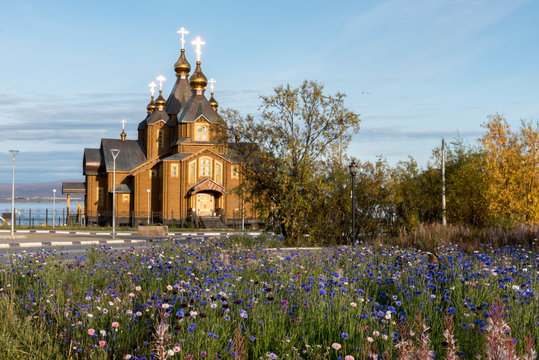 Wooden Church Against Blue Sky In Anadyr, Russia