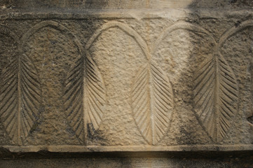 a fragment of an ornament carved in stone