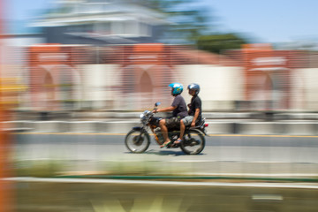 Fototapeta premium Motion Blurred panning photo of Unidentified name people riding motorcycle