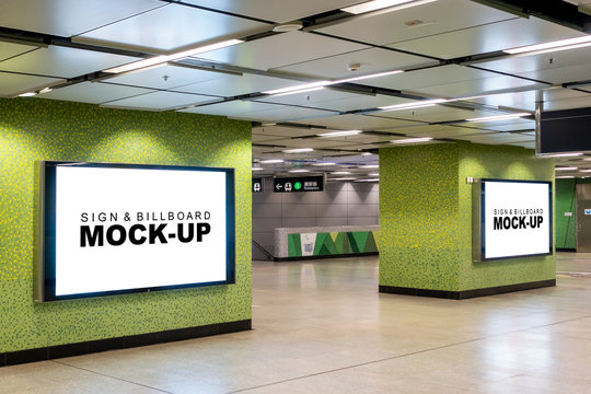 Mock up large blank horizontal billboard in metal frame with clipping path on the beautiful wall in walkway of building, empty space for insert advertising or media