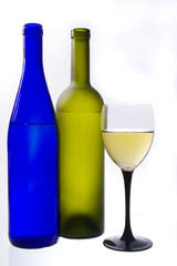 Glass of wine, two bottles and grapes on a white background.Isolated on white.