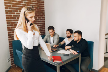 People working. Beautiful woman in a white shirt. Businessman working in a office.