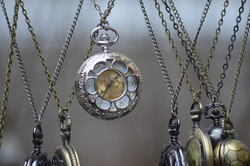 old pocket watch with chain on white background