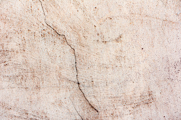 Texture of a concrete wall with cracks and scratches which can be used as a background