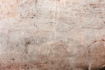 Texture of a concrete wall with cracks and scratches which can be used as a background
