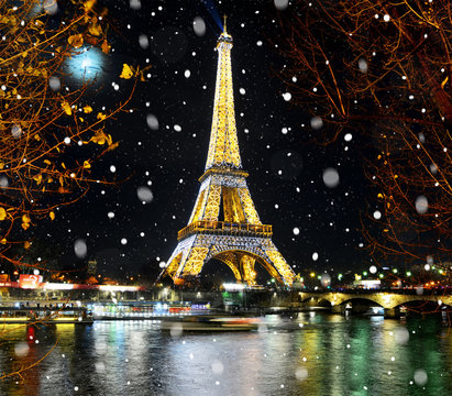 PARIS, FRANCE - DECEMBER 09,2016: Eiffel Tower light performance show in Paris by Christmas snowy night. Eiffel Tower is most visited monument in France and use 20,000 light bulbs in the night show