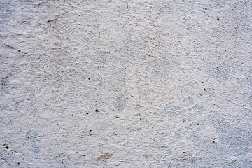 Texture of a concrete wall with cracks and scratches which can be used as a background