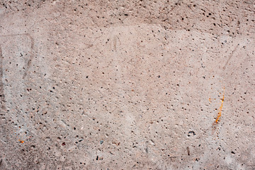Texture of a concrete wall with cracks and scratches which can be used as a background