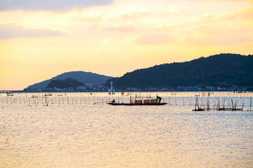 Local fishing boats fish in the sea, morning sunrise with beautiful light  Fishermen in Songkhla, Thailand