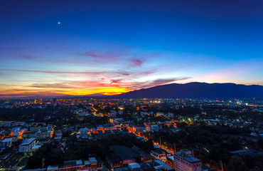 Obraz premium Twilight sky after sunset over city lights of Chiang Mai , Thailand.