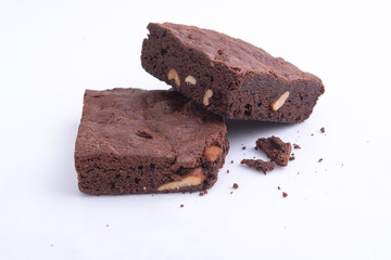 brownies with macadamia nuts on white background