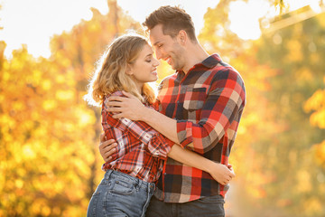 Fototapeta premium Happy young couple on romantic date in park