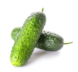 Fresh green cucumbers on white background