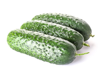 Fresh green cucumbers on white background