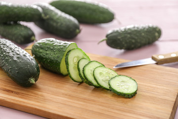 Sliced green cucumber on cutting board