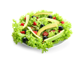 Plate with tasty avocado salad on white background