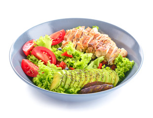 Plate with tasty avocado salad on white background